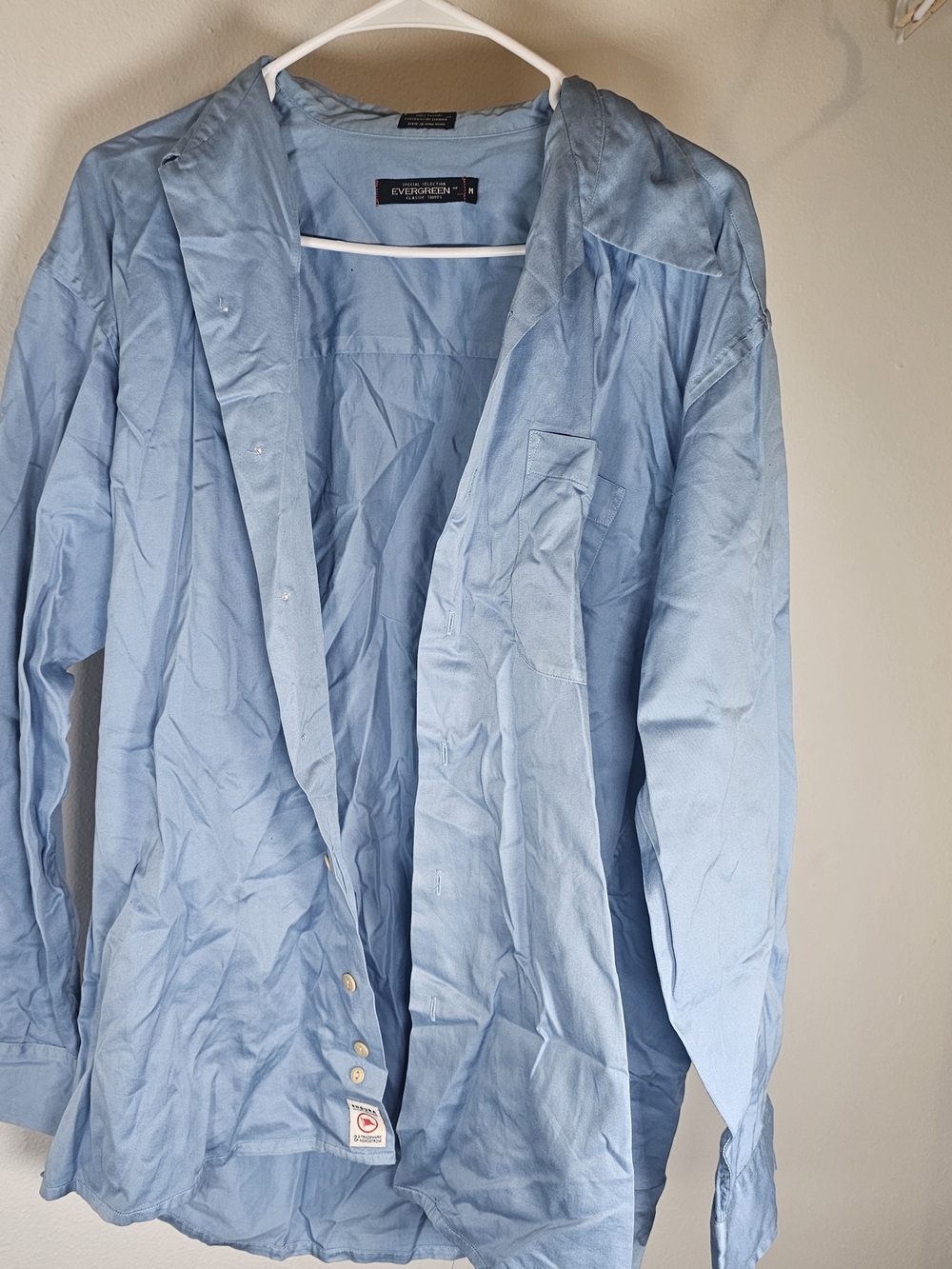light blue Evergreen brand button-down shirt features a chest pocket